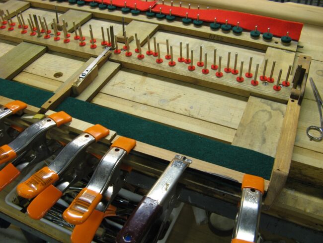 Installing new felts on key frame