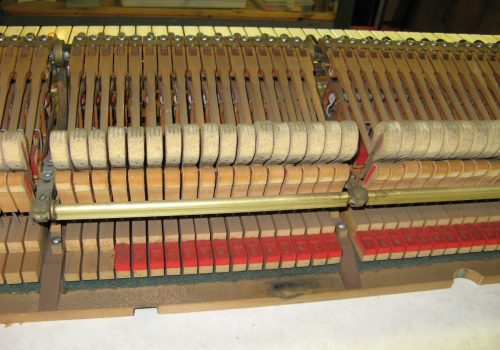 Worn hammers on a grand piano